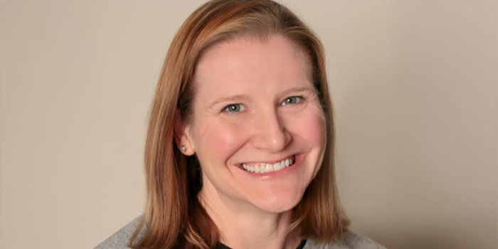 a woman smiling for the camera